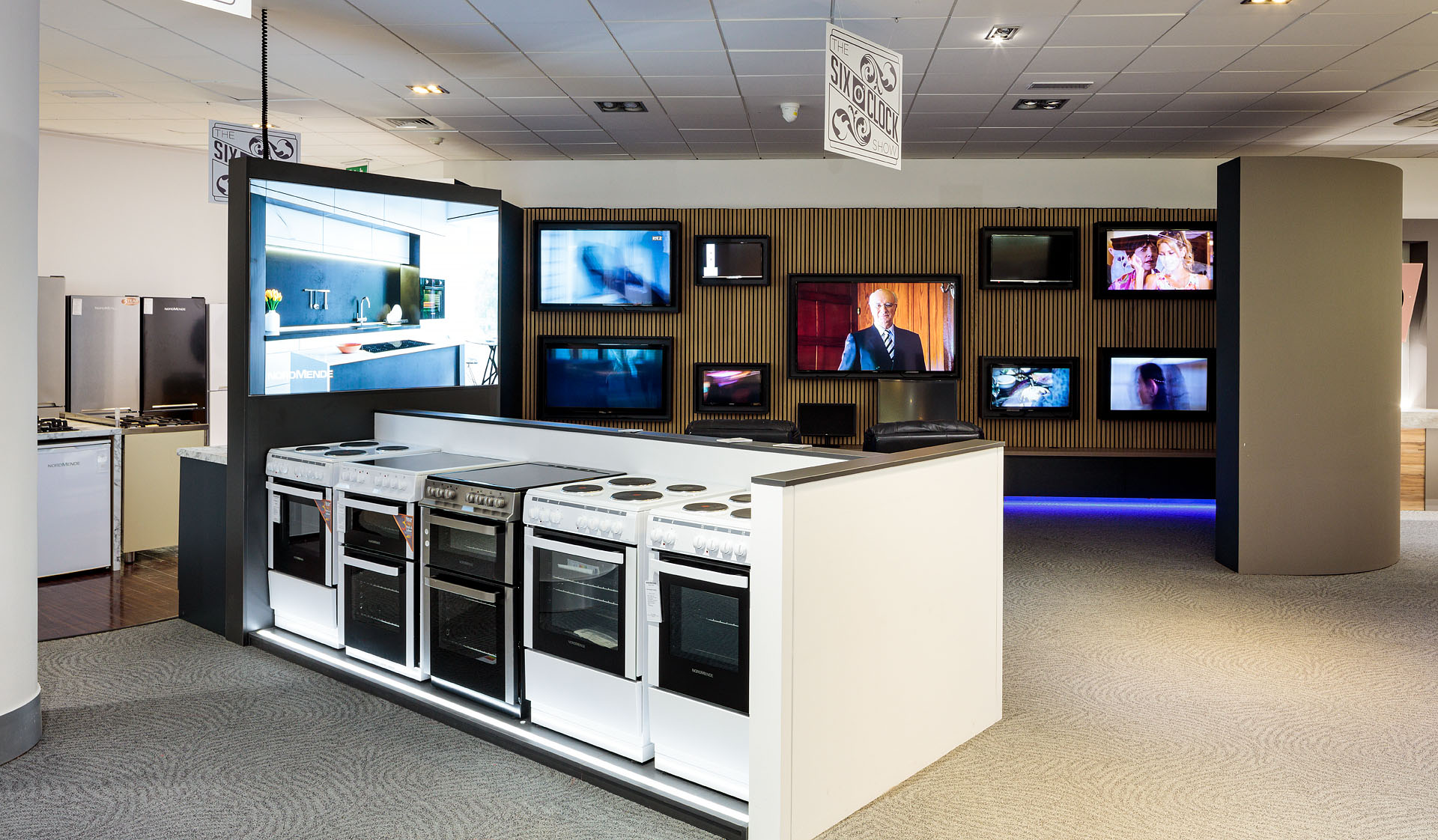 Appliance wall showcasing refrigeration and compact appliances